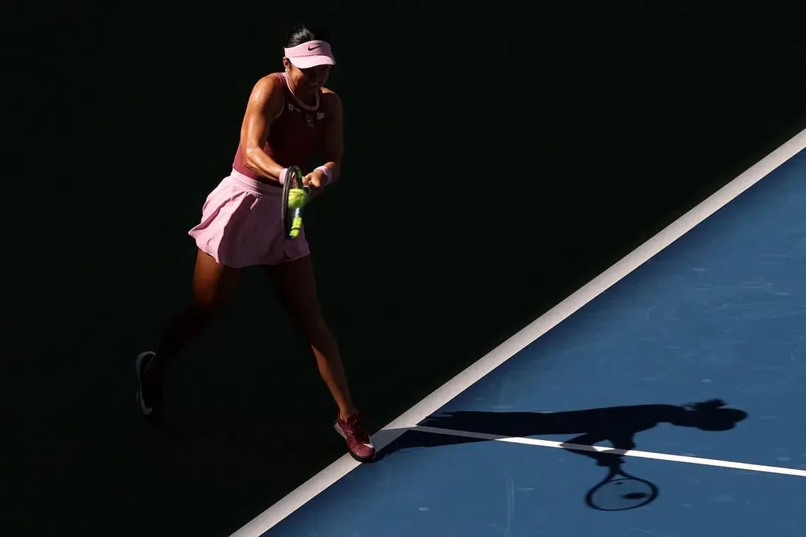 Tennis player hitting a shot on the court