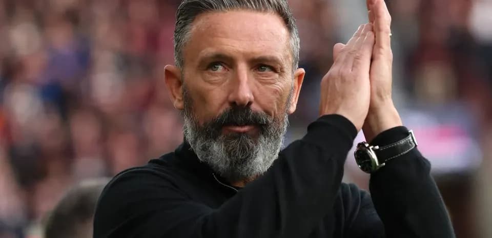 Coach applauding fans during a match