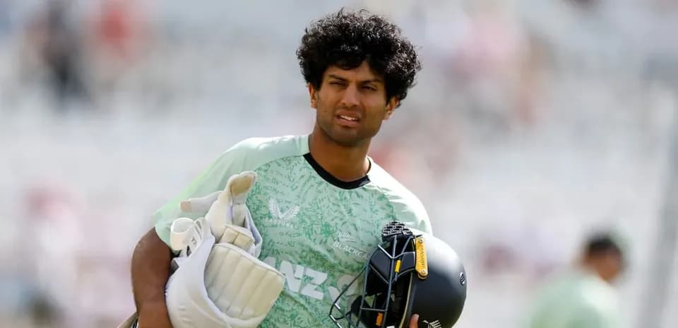 Cricketer walking with gear before the match
