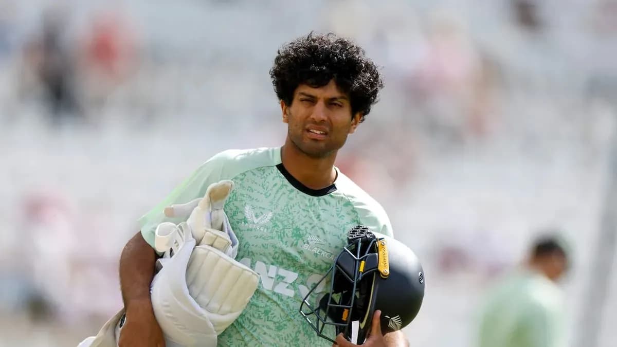 Cricketer walking with gear before the match