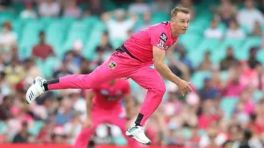 Bowler delivering ball during cricket match
