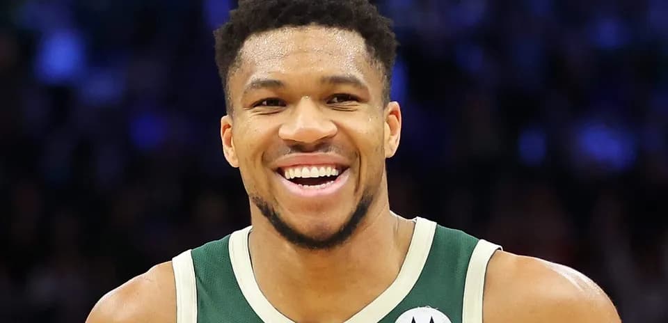 Basketball player smiling during game celebration