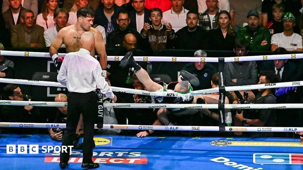 Boxer knocked out, falling out of the ring