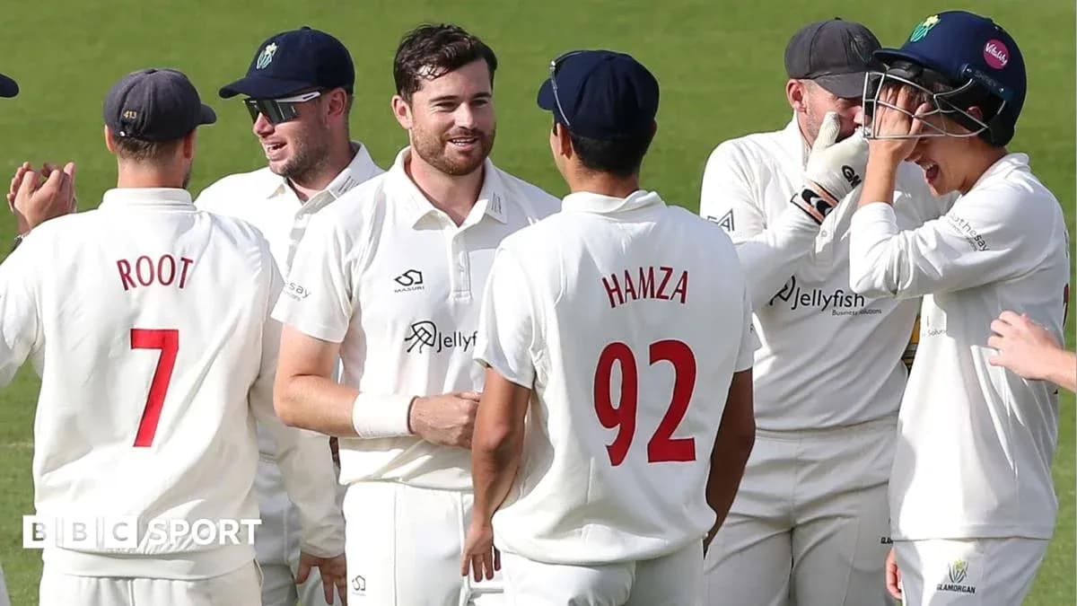 Cricket players celebrating a wicket on the field