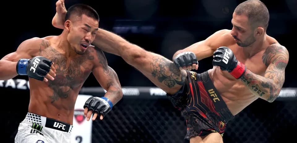 Two fighters engaged in a striking exchange in UFC