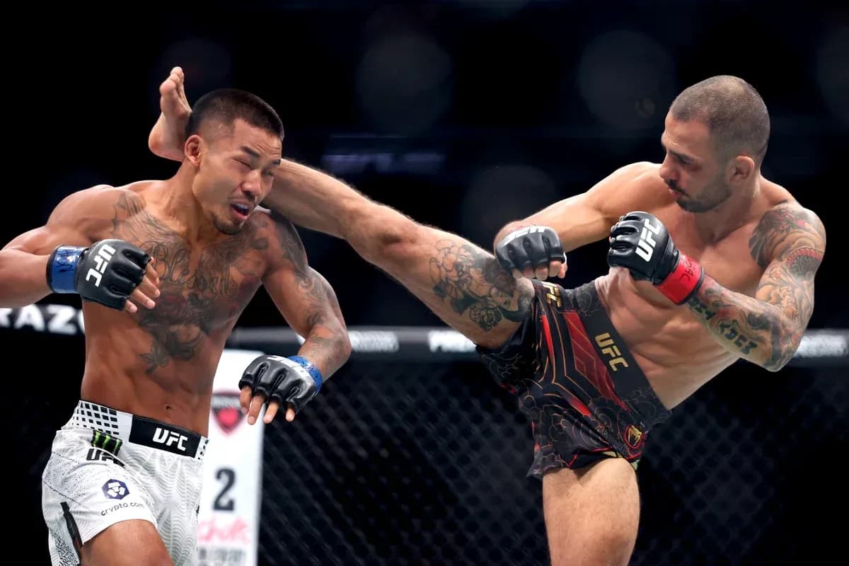 Two fighters engaged in a striking exchange in UFC