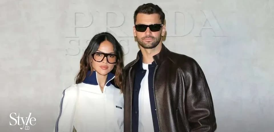 Couple posing together at fashion event