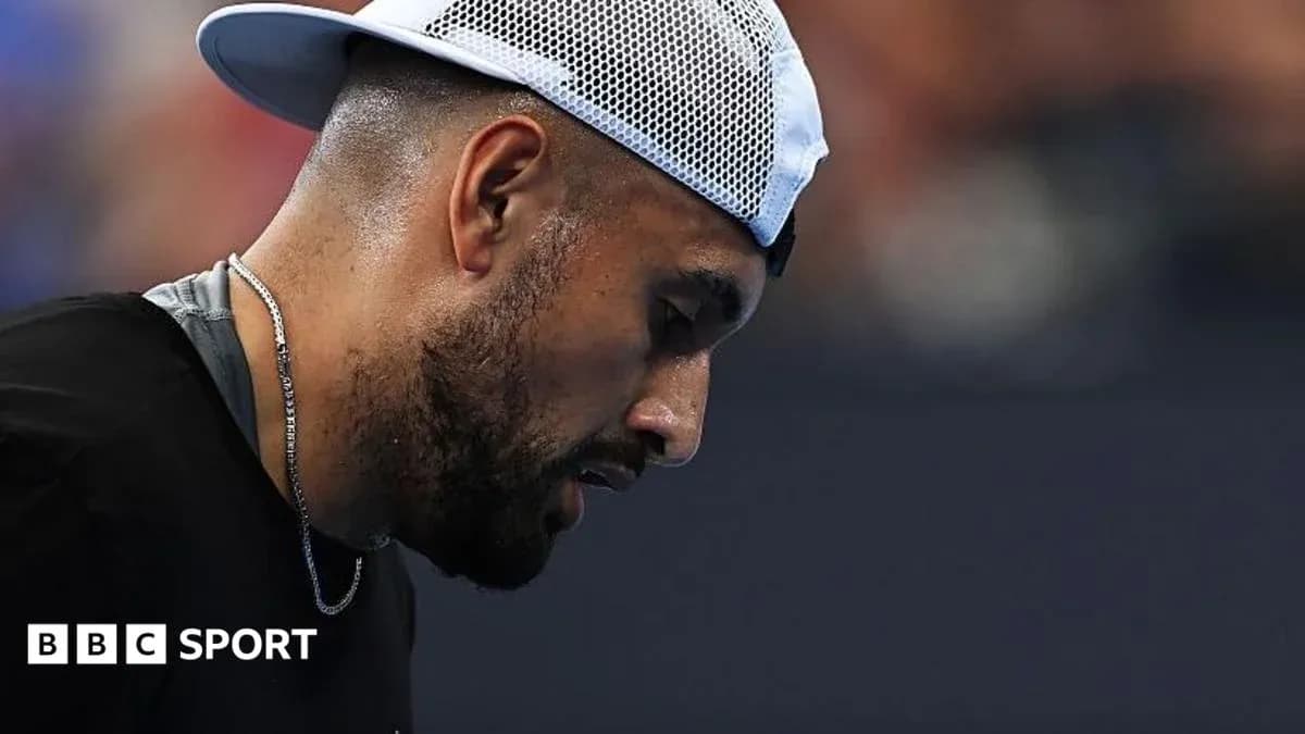 Tennis player looking down during a match