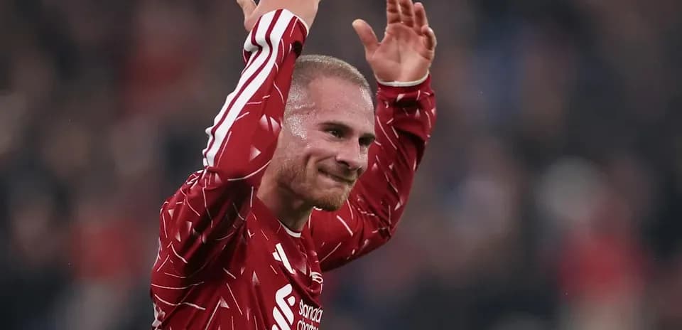Player celebrating with raised arms on the field