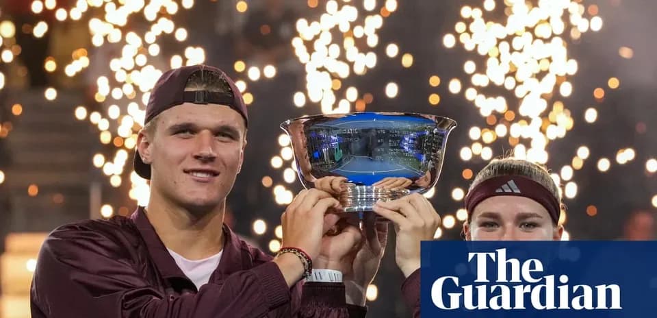 Two tennis players celebrating with trophy and fireworks
