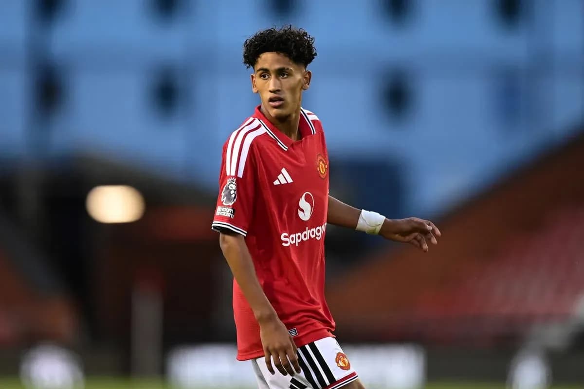 Player in Manchester United jersey on the pitch