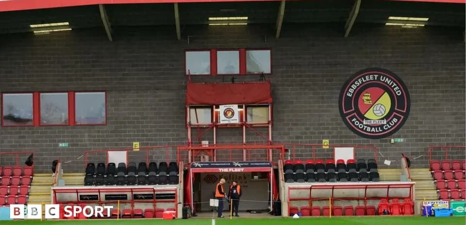 Ebbsfleet United stadium entrance with staff members