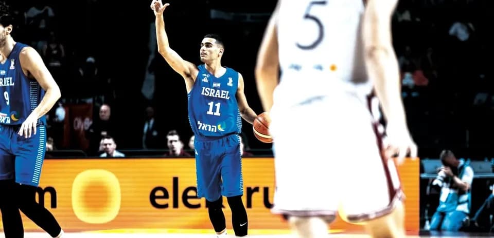 Israeli player signaling during basketball game action