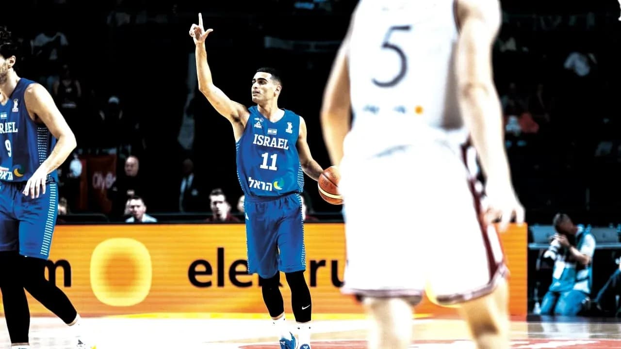 Israeli player signaling during basketball game action
