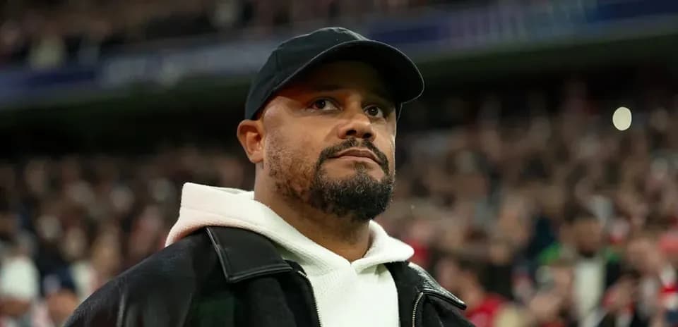 Man in a black cap and jacket at stadium