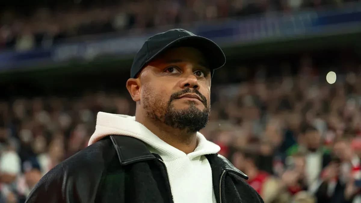 Man in a black cap and jacket at stadium