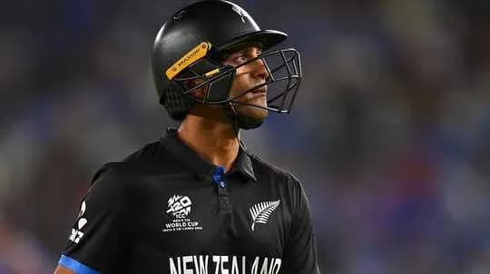 New Zealand player in black kit looking up