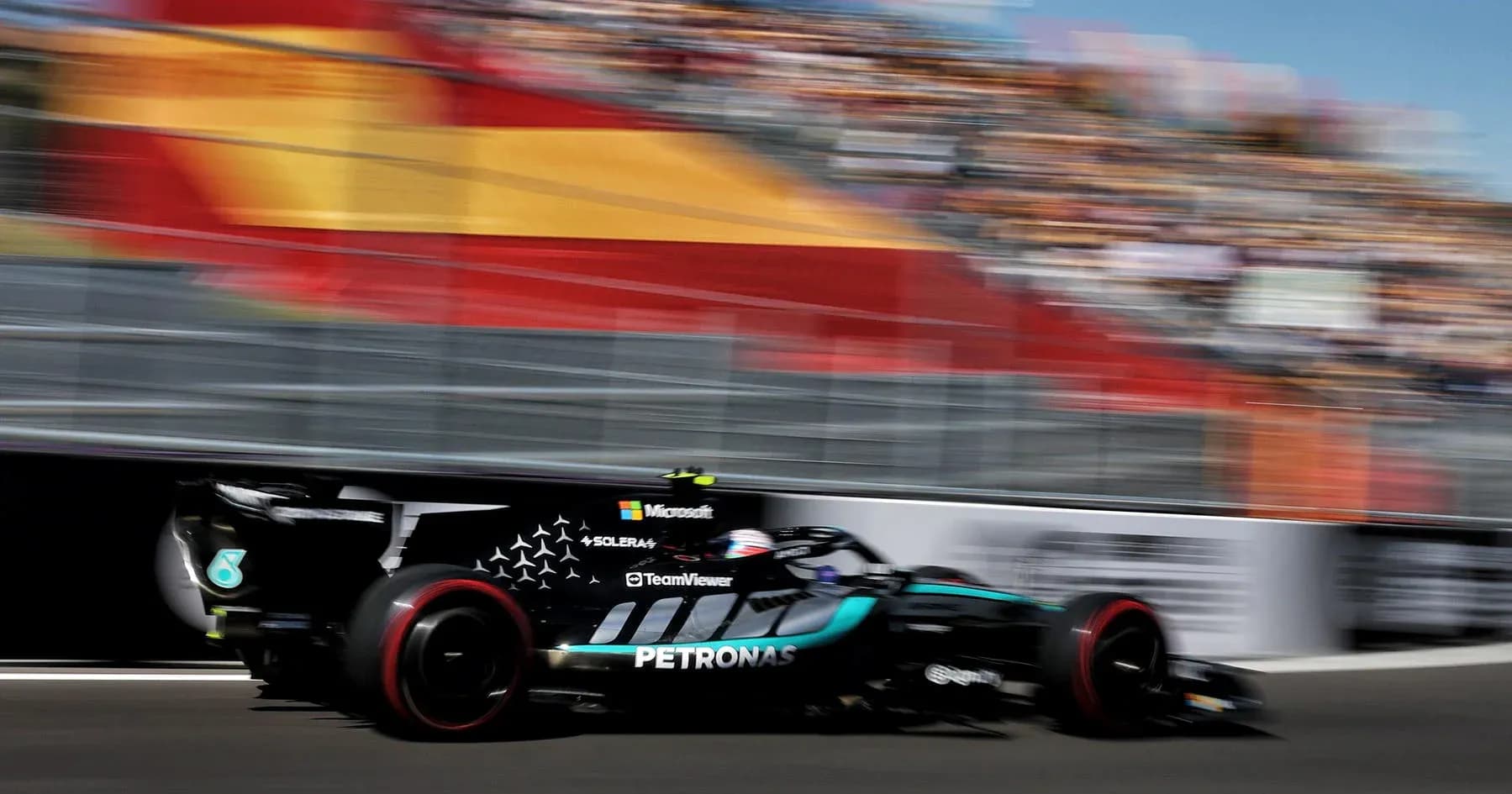 Formula 1 car racing past at high speed
