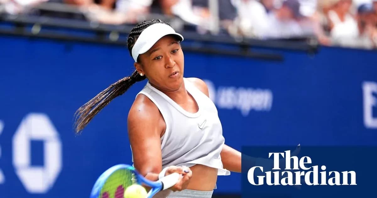 Naomi Osaka hitting a tennis ball during match