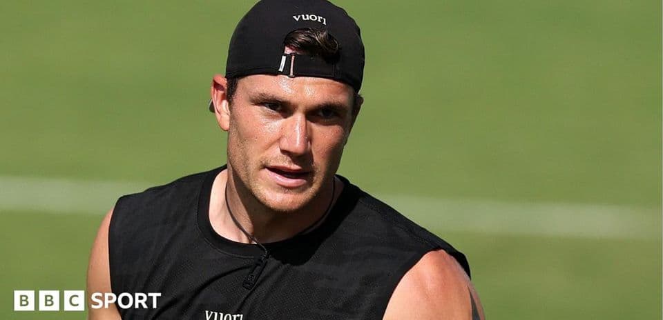 Athlete in black training gear on field