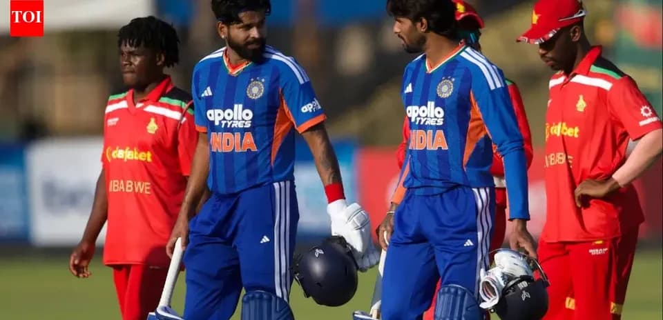 Two Indian cricketers walking off the field