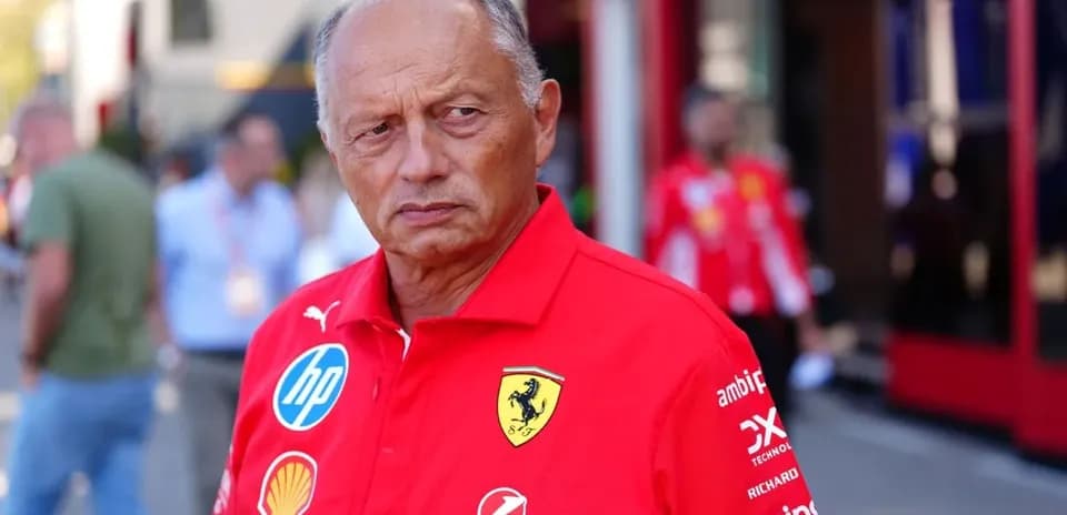 Team principal in Ferrari uniform at racing event