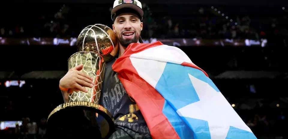 Player celebrating with trophy and flag after victory