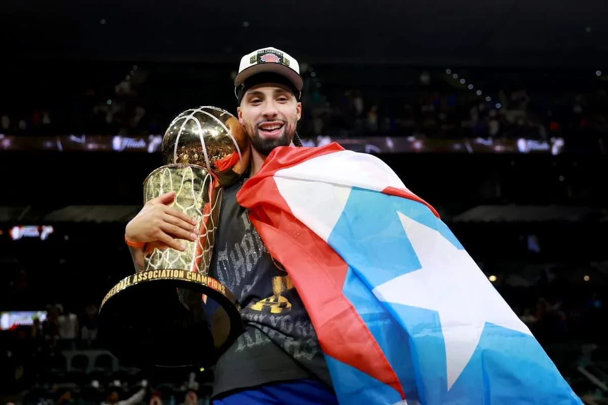 Player celebrating with trophy and flag after victory