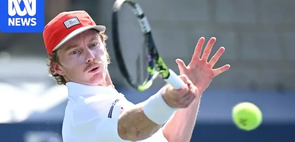 Tennis player hitting a forehand shot during match