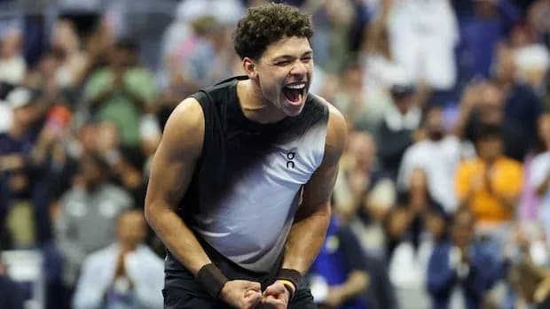 Player celebrating victory during tennis match
