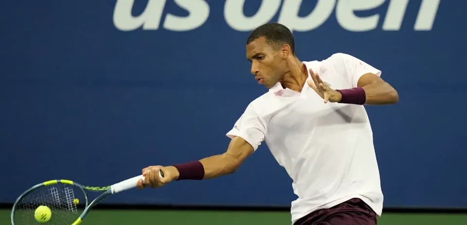 Player hitting a backhand shot at US Open