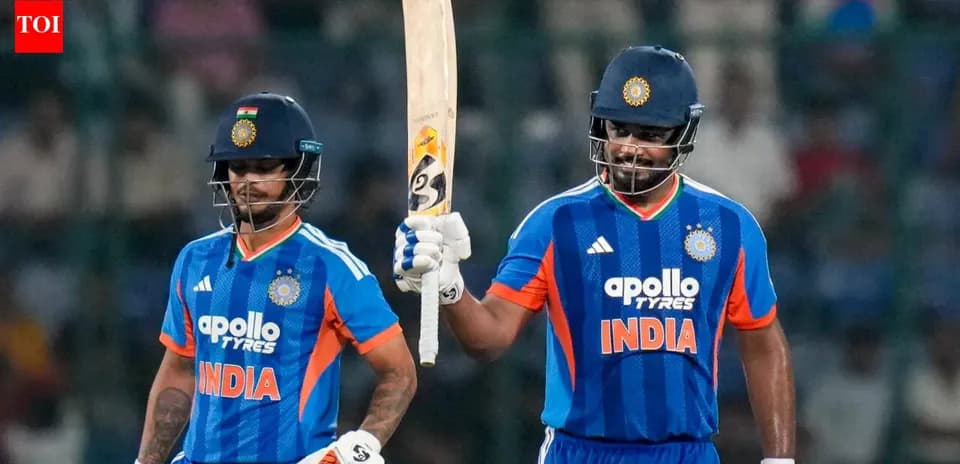 Two Indian cricketers celebrating a partnership on field