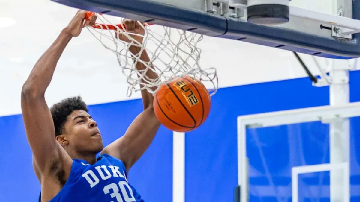 Player dunking a basketball during practice session