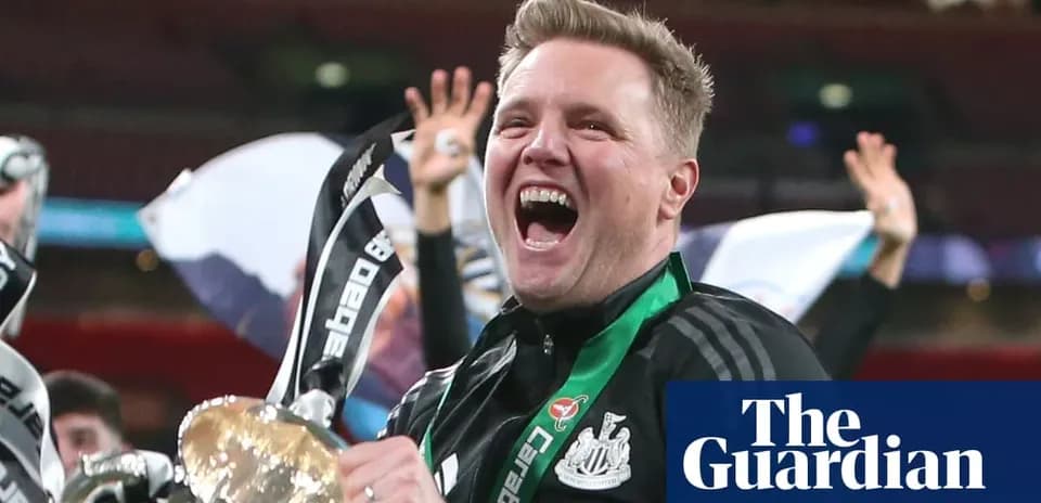 Manager celebrating with trophy after match victory
