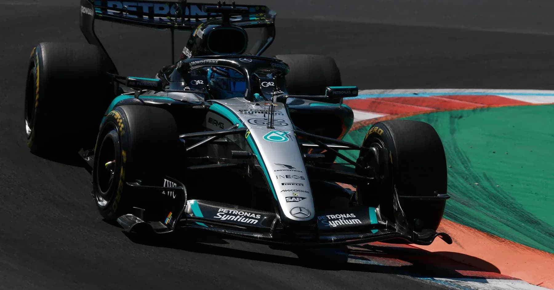 Mercedes Formula 1 car navigating a corner on track