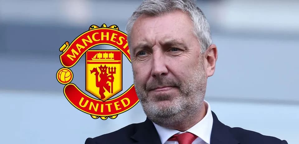 Man in suit with Manchester United logo background