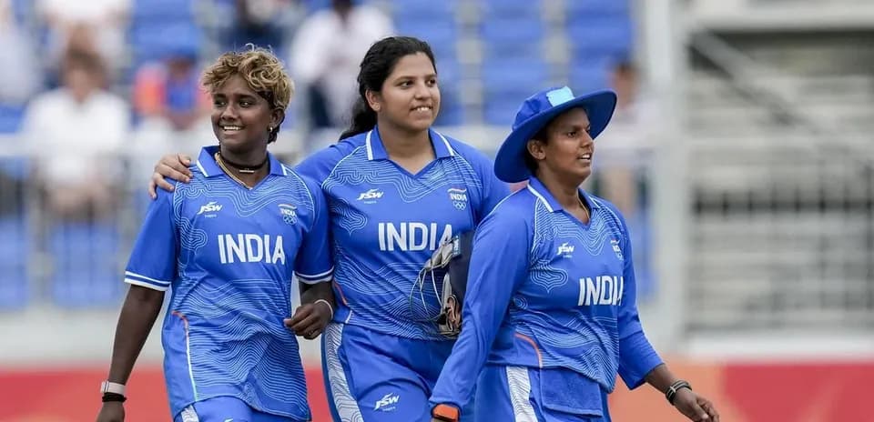 Indian women cricketers walking off the field together