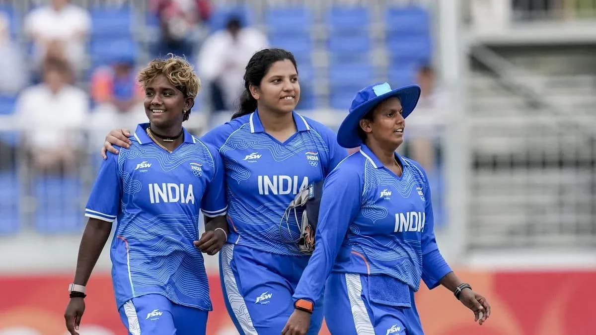 Indian women cricketers walking off the field together