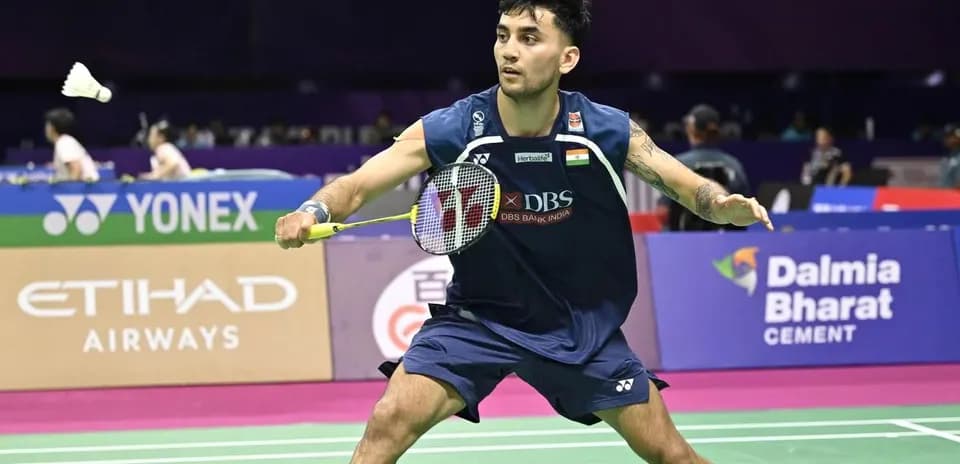 Player preparing to hit shuttlecock during badminton match