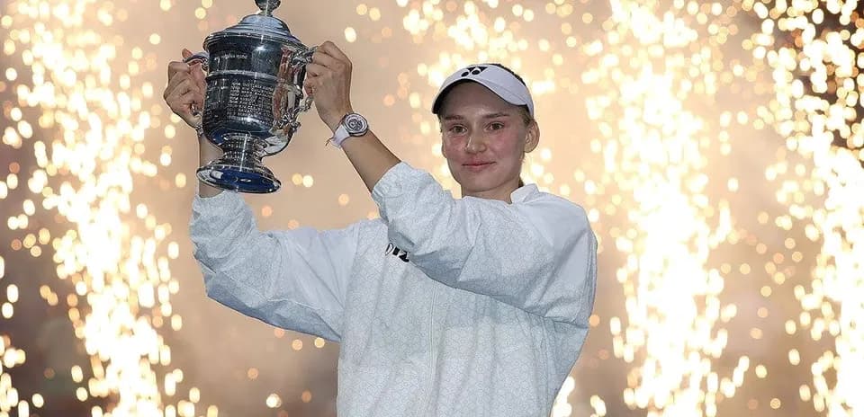 Player celebrating with trophy amid fireworks display