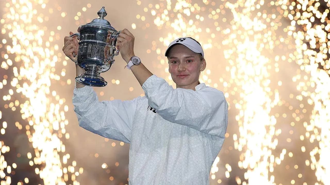 Player celebrating with trophy amid fireworks display