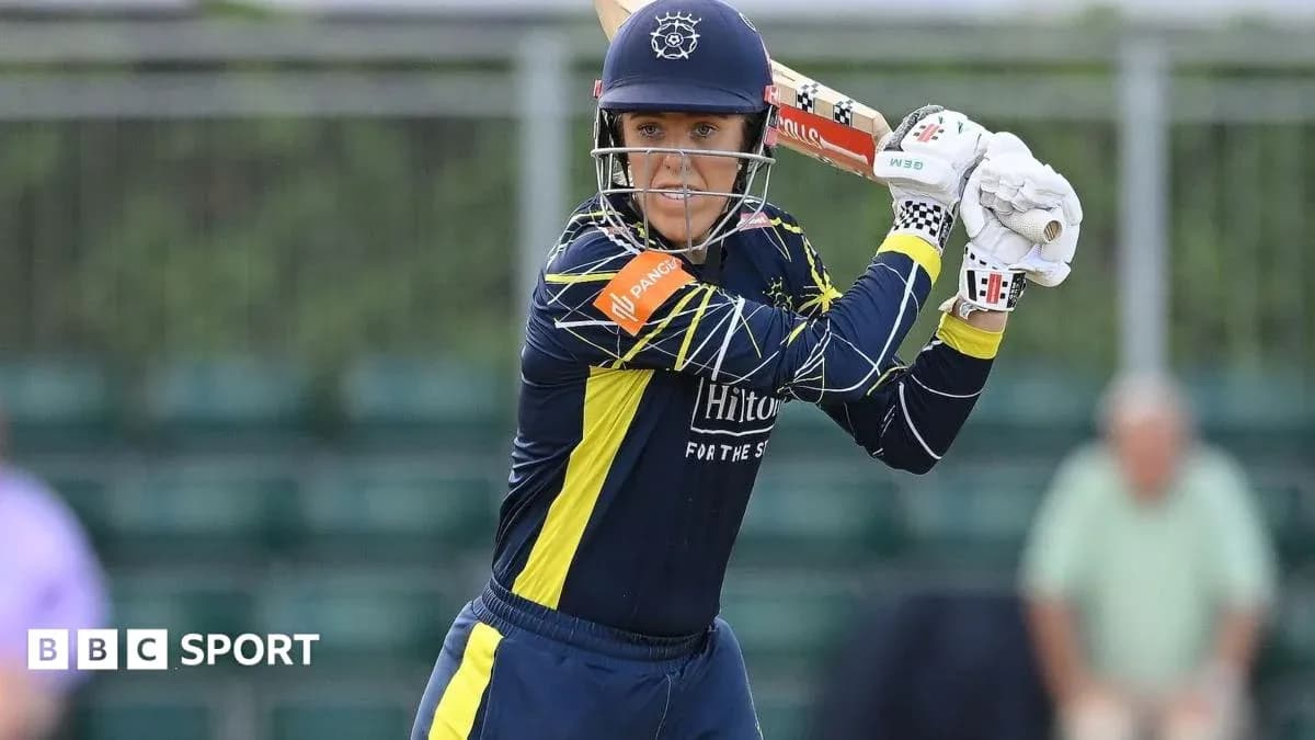 Cricketer preparing to bat during match