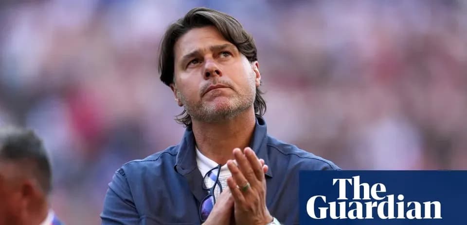 Coach with hands clasped, looking upward during event