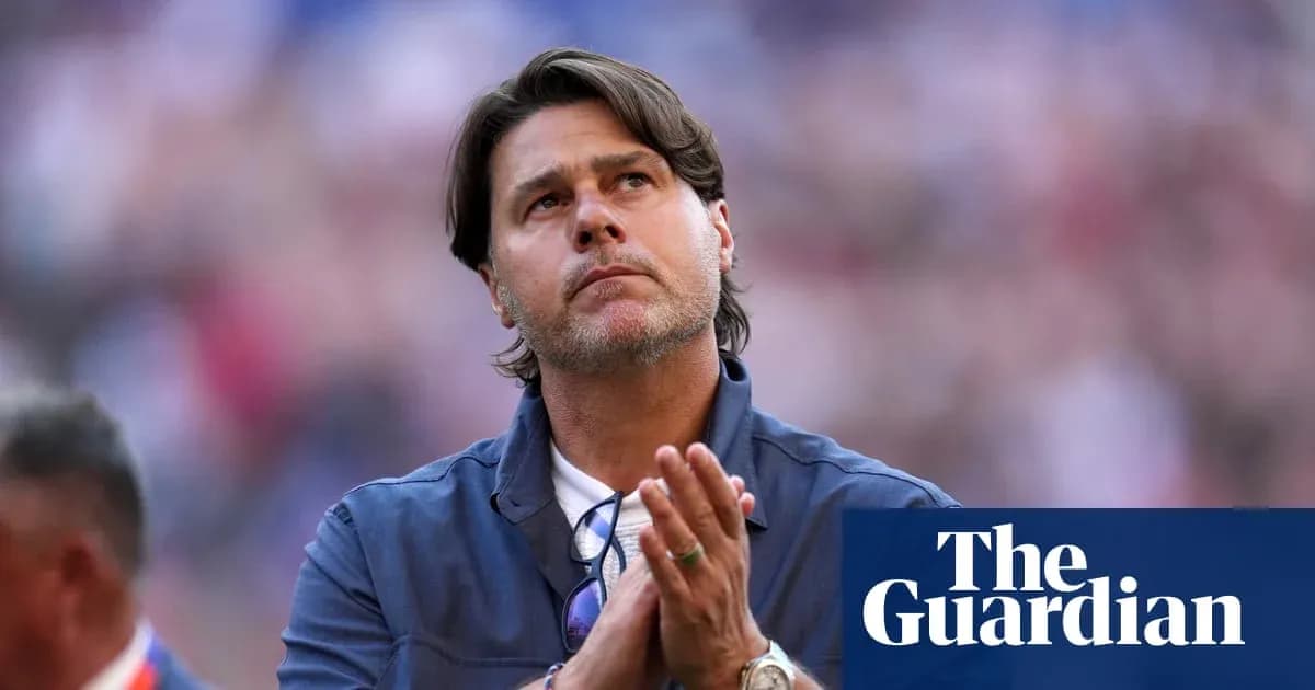 Coach with hands clasped, looking upward during event
