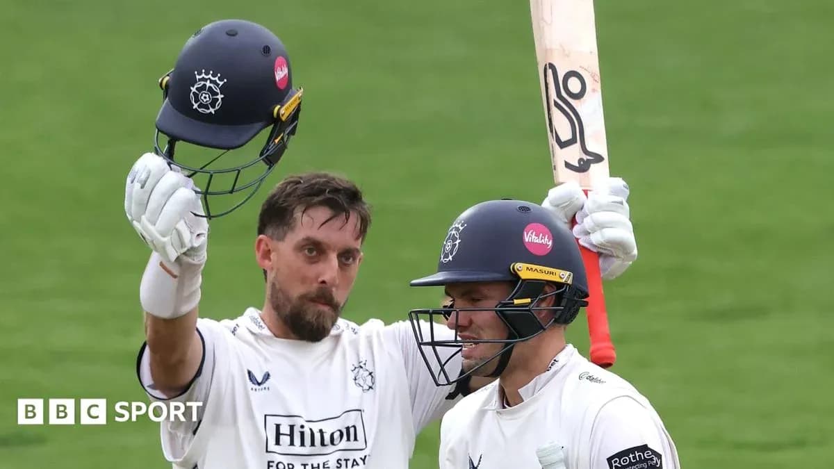Two cricketers celebrating after scoring runs