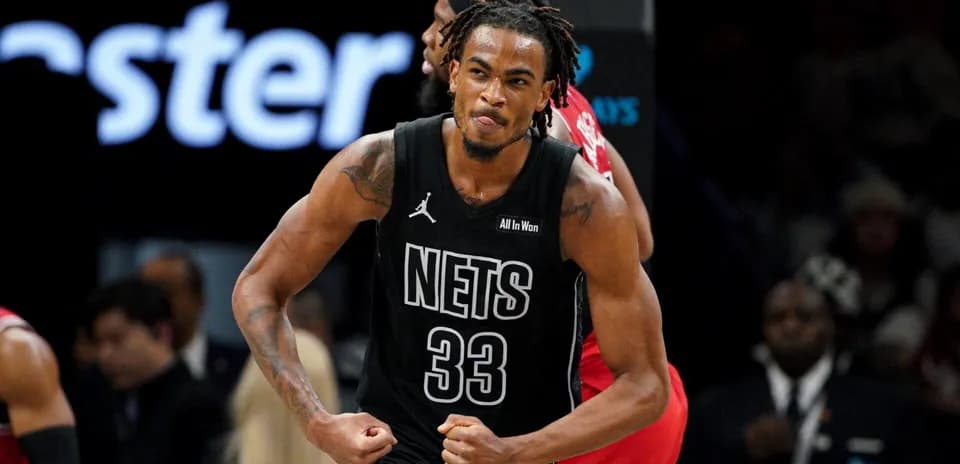 Player celebrating after a successful play for Nets