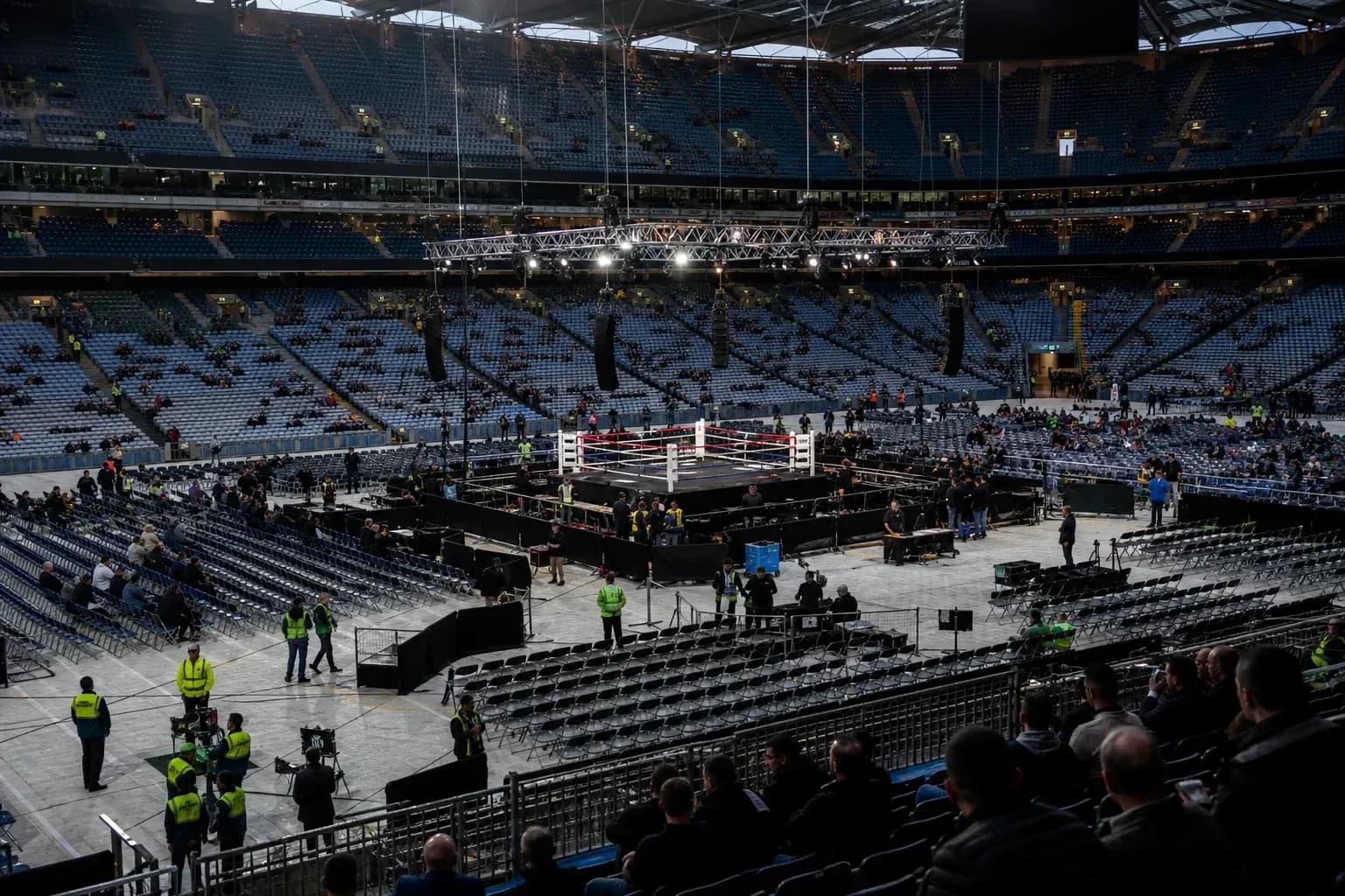 Empty arena with boxing ring and audience seating