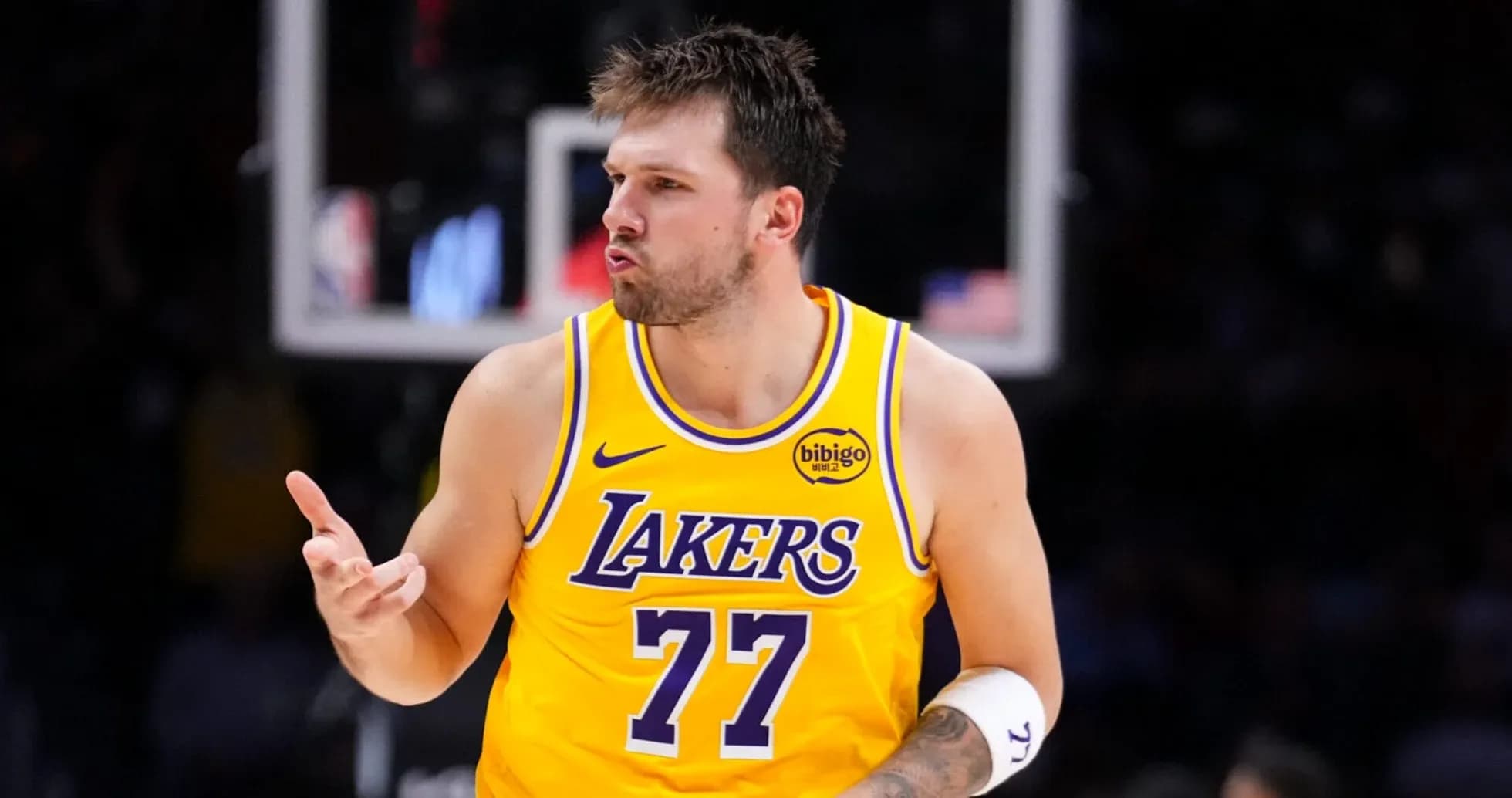 Player gesturing during game in Lakers jersey