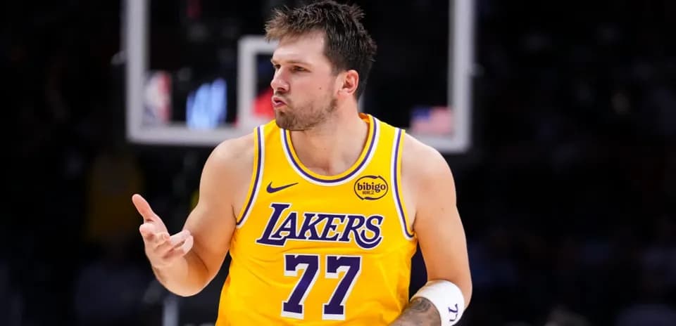 Player gesturing during game in Lakers jersey