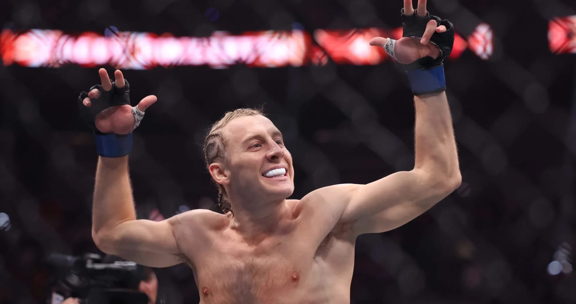 Fighter celebrating victory in the octagon